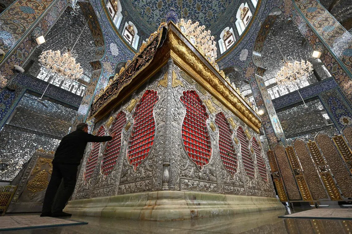 A Muslim man praying in the shrine of Sayyida Zaynab, locally believed to hold the grave of Zaynab bint Ali, the daughter of Ali and Fatima, and granddaughter of the Islamic prophet Mohammad, in the southern suburbs of Damascus, on Dec 11, 2024.