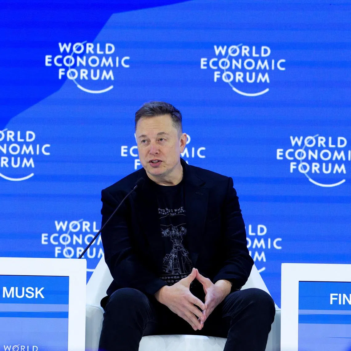 Elon Musk attends the 56th annual World Economic Forum (WEF) meeting in Davos, Switzerland, January 22, 2026. REUTERS/Denis Balibouse