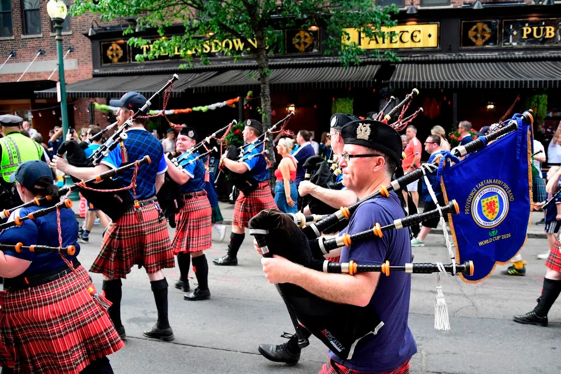 Soccer Football - FIFA World Cup 2026 - Scotland's Tartan Army march to Boston's Fenway Park baseball stadium - Boston, Massachusetts, U.S. - June 14, 2026 Scotland fans wearing kilts and playing the bagpipes during the march to Fenway Park IMAGN IMAGES via Reuters/Bob Dechiara