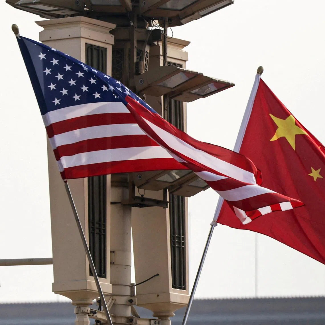 FILE PHOTO: U.S. and China’s national flags flutter in Tiananmen Square, ahead of U.S. President Donald Trump's visit to China, in Beijing, China, May 13, 2026. REUTERS/Maxim Shemetov/File Photo