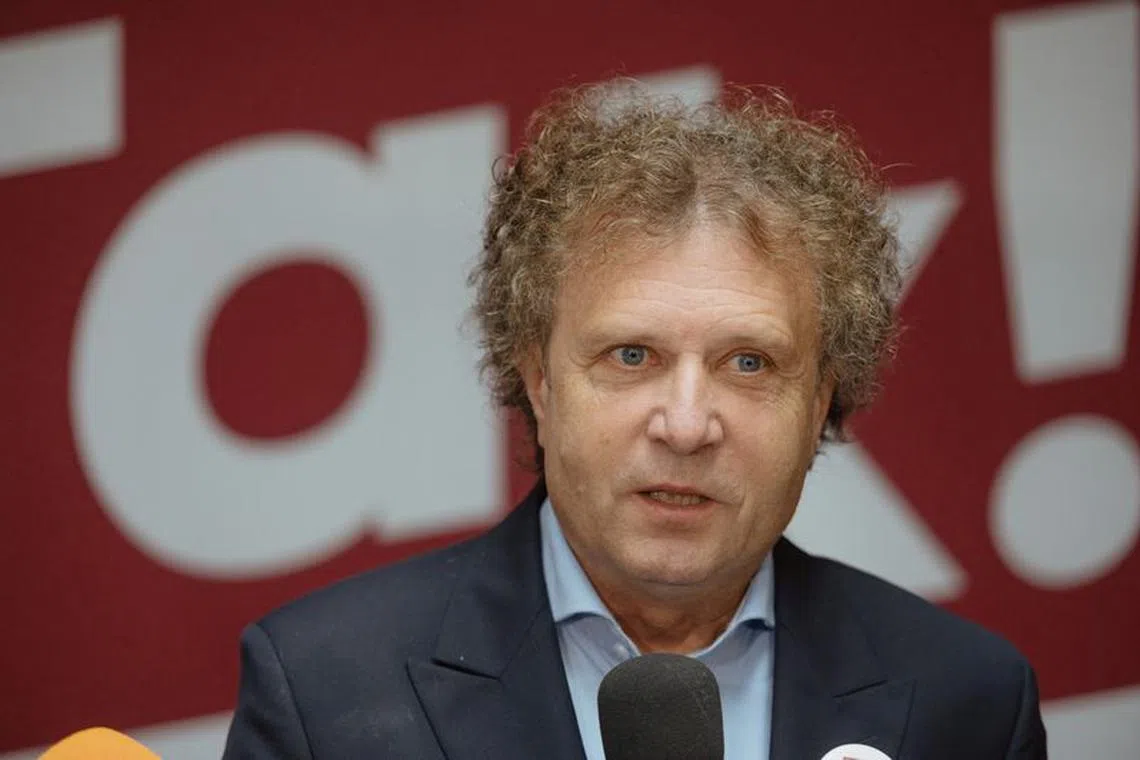 Jacek Karnowski, former mayor of Sopot who has now been elected to the Polish Parliament, speaks after having his hair cut, fulfilling a promise that he would do so when the country's ruling nationalist Law and Justice (PiS) party were voted out of office, in Sopot, Poland, October 18, 2023.  Agencja Wyborcza.pl/Bartosz Banka via REUTERS