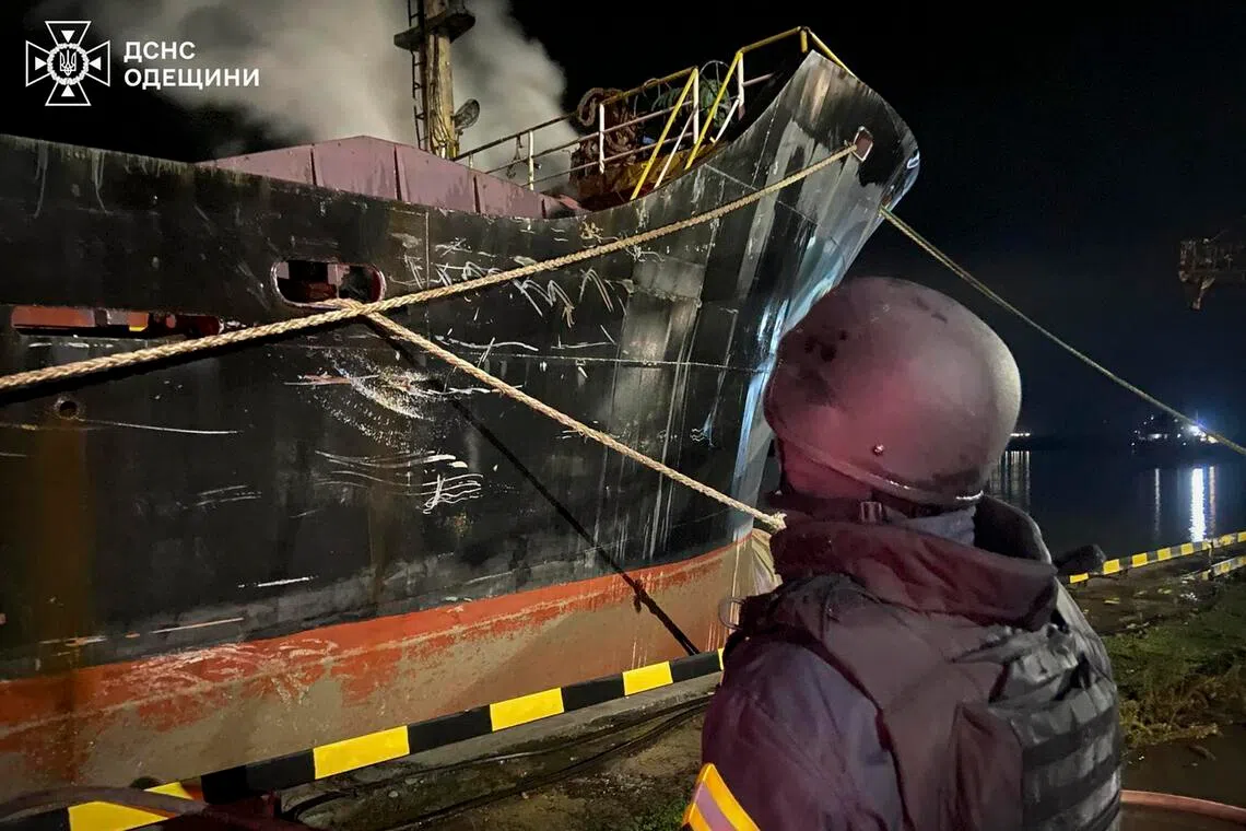 Ukrainian rescuers working at the site of a Russian strike on port facilities in Ukraine's Odesa region on Dec 23.