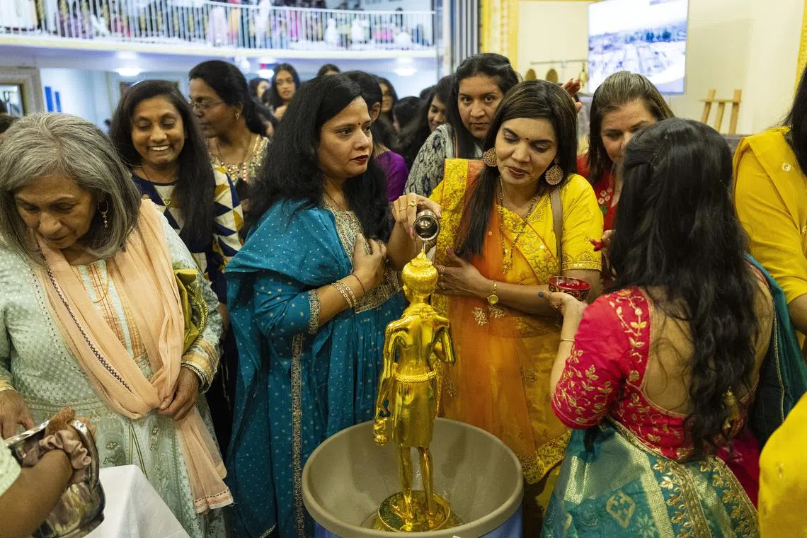 Hindu devotees attending a ceremony during the annual Diwali festival at the Shri Swaminarayan Mandir Hindu Temple in Johannesburg, South Africa on Nov 12, 2023. 