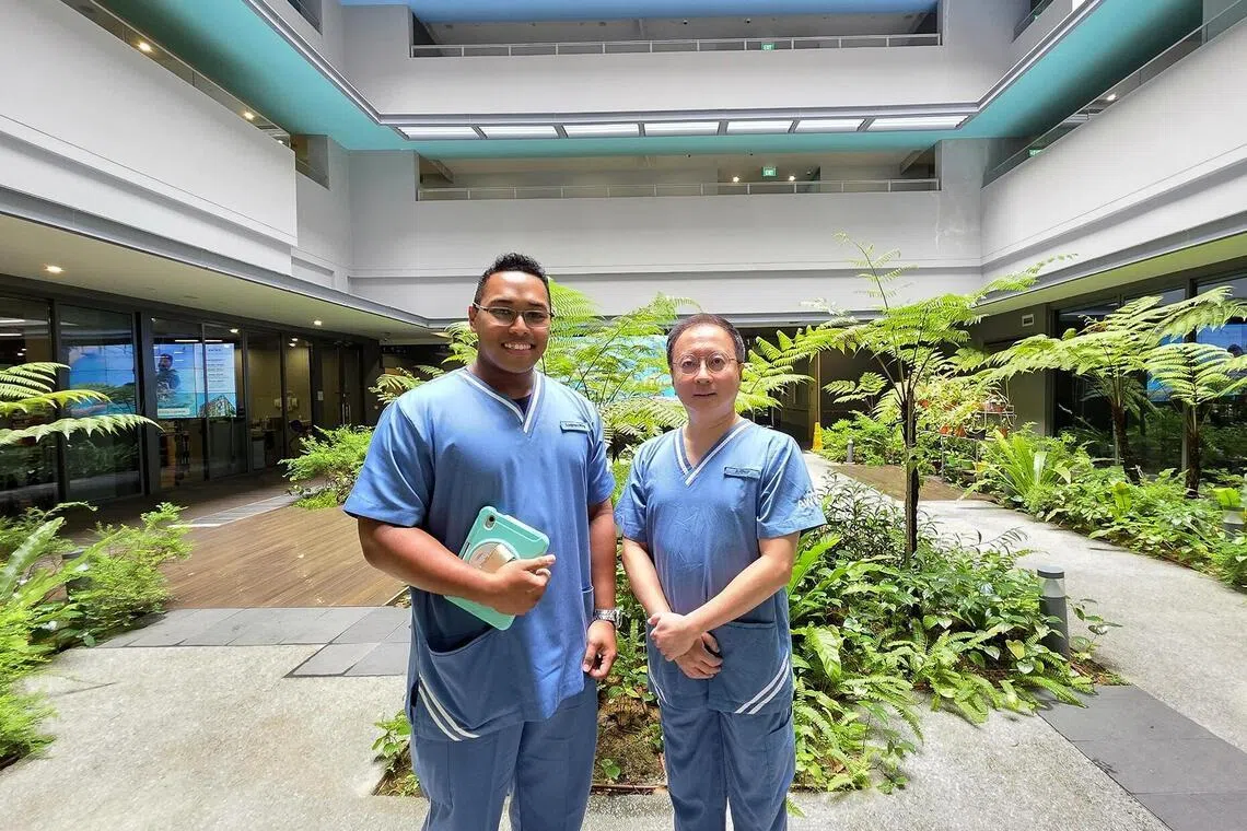 Staff nurse Luqman Rifqi (left) and nurse educator Arthur Lee pitched an idea using AI to structure and digitise the standard operating procedures of AWWA’s adult disability services.