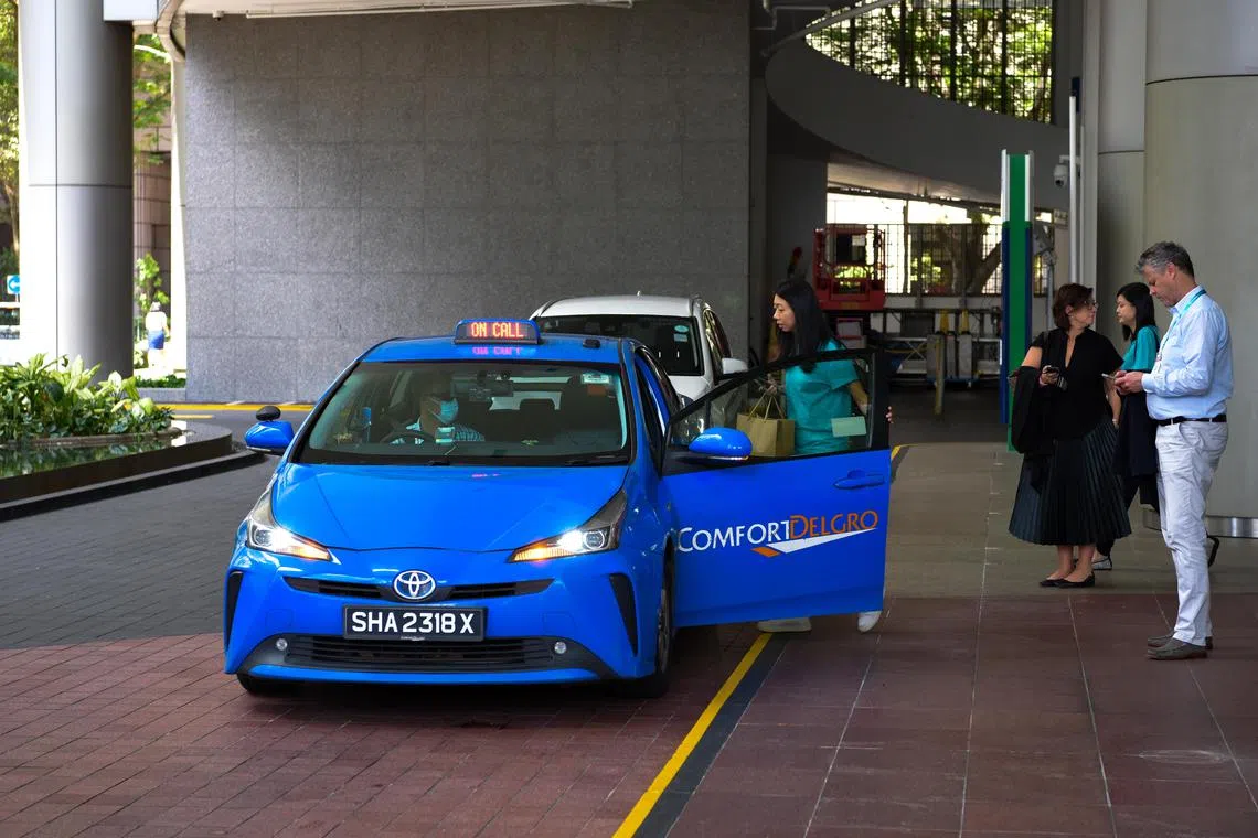 Eugene Tan-pixgeneric/

Comfort Delgro operates the ubiqutious blue Singapore taxis

(ST PHOTO: EUGENE TAN)