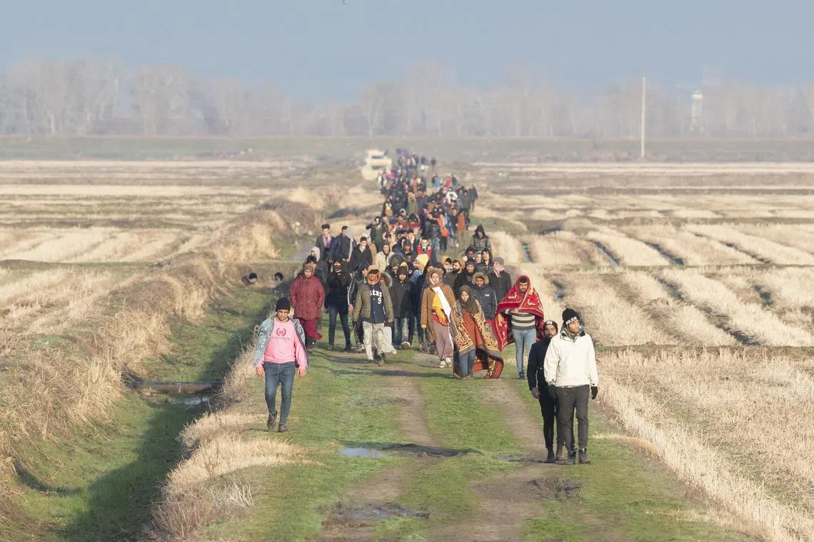 Refugees walking back in 2020 after a failed bid to cross the border to Greece from Turkey near Evros River.