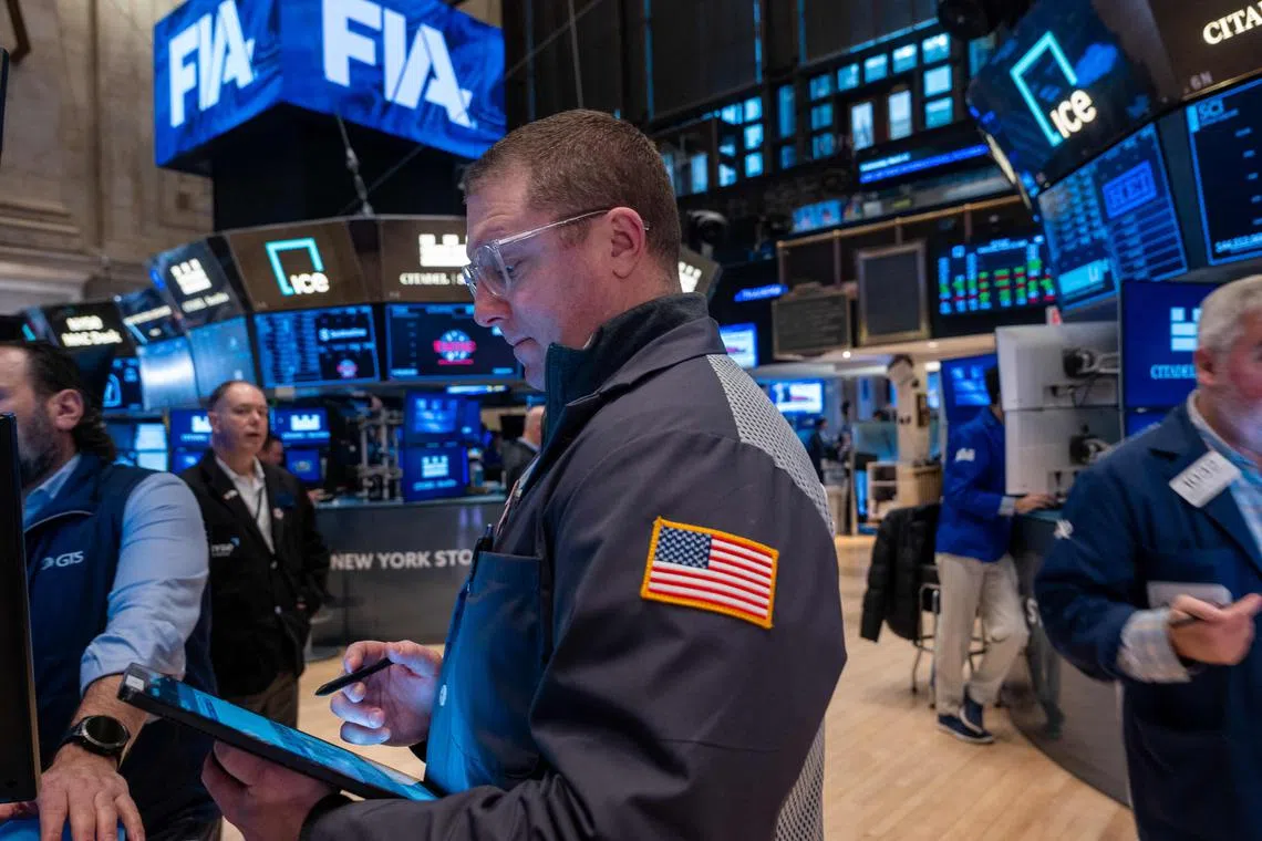Traders work on the floor of the New York Stock Exchange on March 12, in New York City.