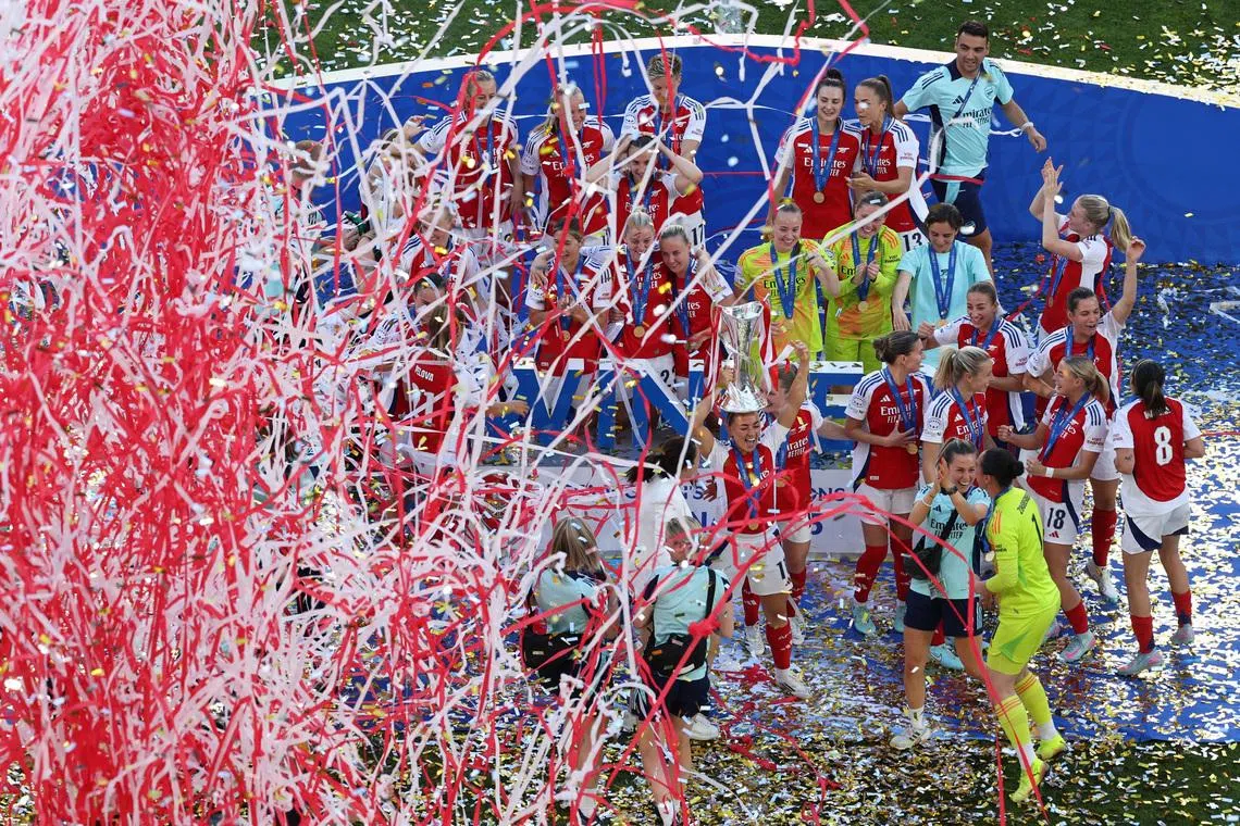 Soccer Football - Women's Champions League - Final - Arsenal v FC Barcelona - Estadio Jose Alvalade, Lisbon, Portugal - May 24, 2025 Arsenal's Katie McCabe celebrates with the trophy after winning the Champions League REUTERS/Violeta Santos Moura