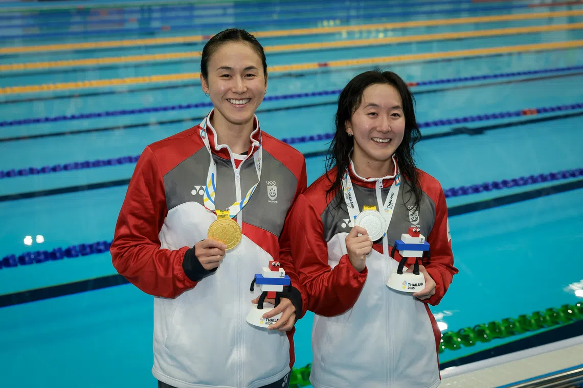 Quah Ting Wen (left) and Quah Jing Wen at the Sports Authority of Thailand Swimming Pool during the SEA Games in Bangkok on Dec 13.