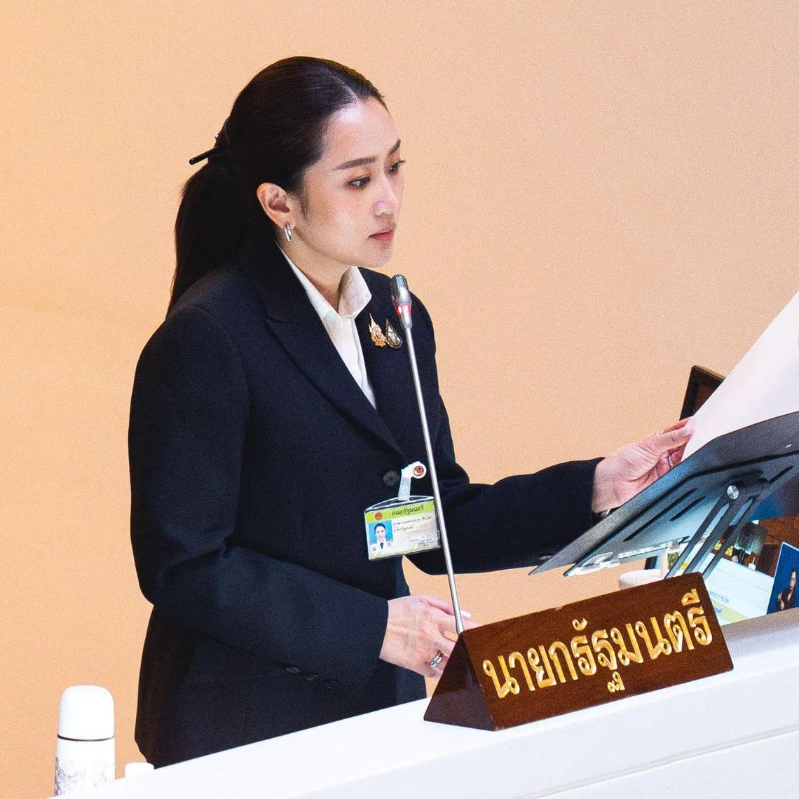 Thailand's Prime Minister Paetongtarn Shinawatra, known by her nickname "Ung Ing" and daughter of former prime minister Thaksin Shinawatra, arrives to deliver the cabinet policy speech at the parliament chamber in Bangkok on September 12, 2024. (Photo by Chanakarn Laosarakham / AFP)