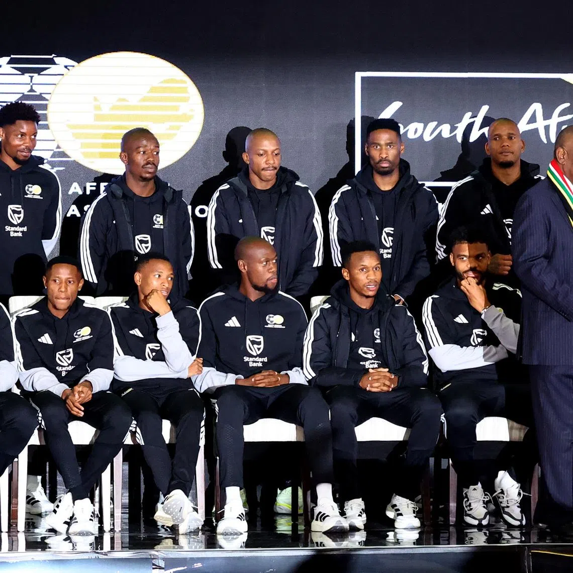 Soccer Football -FIFA World Cup 2026 - South Africa coach Hugo Broos announces his World Cup squad - Sefako Makgatho Presidential Guest House, Pretoria, South Africa - May 27, 2026  South Africa president Cyril Ramaphosa with the squad during the announcement REUTERS/Siphiwe Sibeko