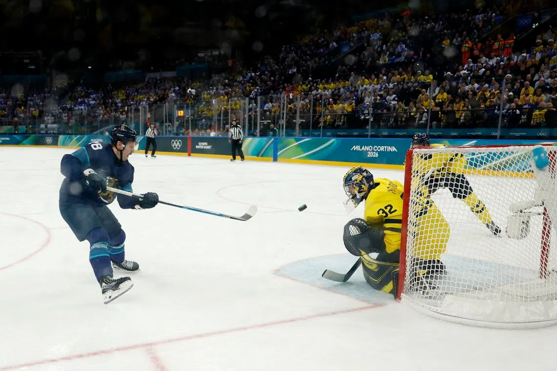 Ice hockey-Finland muscle past Sweden, Slovakia beat hosts Italy, Czechs notch win
