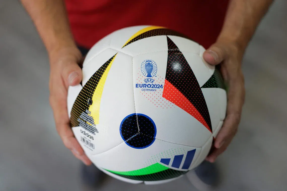 FILE PHOTO: The Euro 2024 match ball 'Fussballliebe' is pictured at Intersport Cary sports clothing store, on the eve of the start of the UEFA Euro 2024 soccer championship, in Ronda, Spain, June 13, 2024. REUTERS/Jon Nazca/File Photo