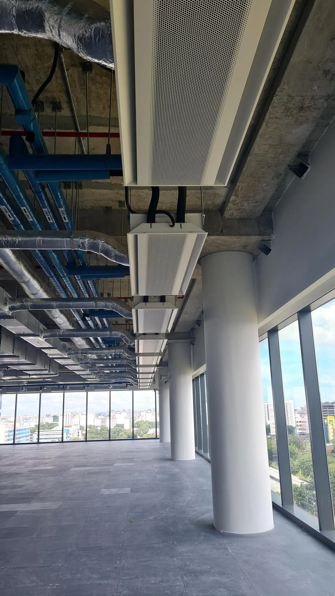 Paya Lebar Green has installed special ceiling-mounted beams that have coils that circulate chilled water.