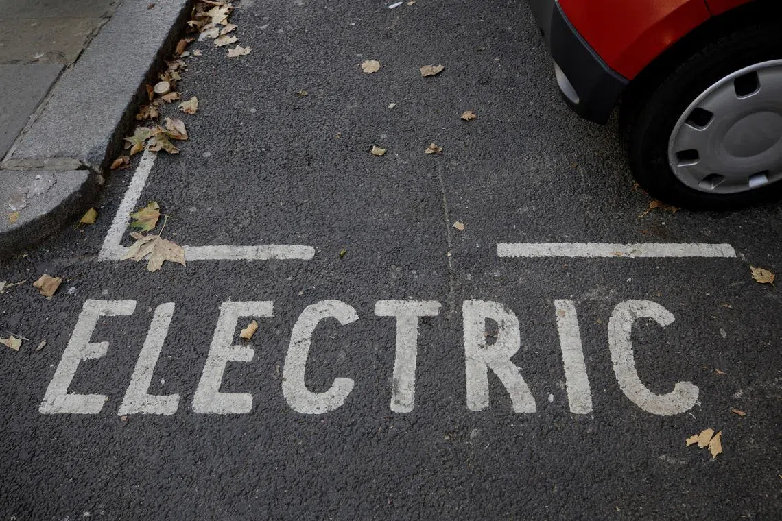 FILE PHOTO: A parking bay reserved for electric car charging can be seen on display in London, Britain, October 19, 2018. REUTERS/Simon Dawson/File Photo