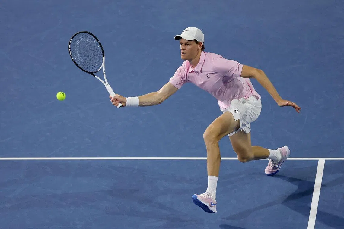 Jannik Sinner of Italy comes to the net against Corentin Moutet of France during their Miami Open clash.