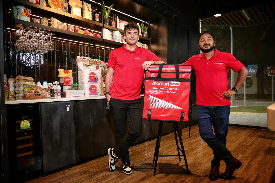 Senior vice-president and head of RedMart Martin Daney (left) and chief logistics officer for RedMart and Lazada Singapore Venkat Shankar at Lazada One.