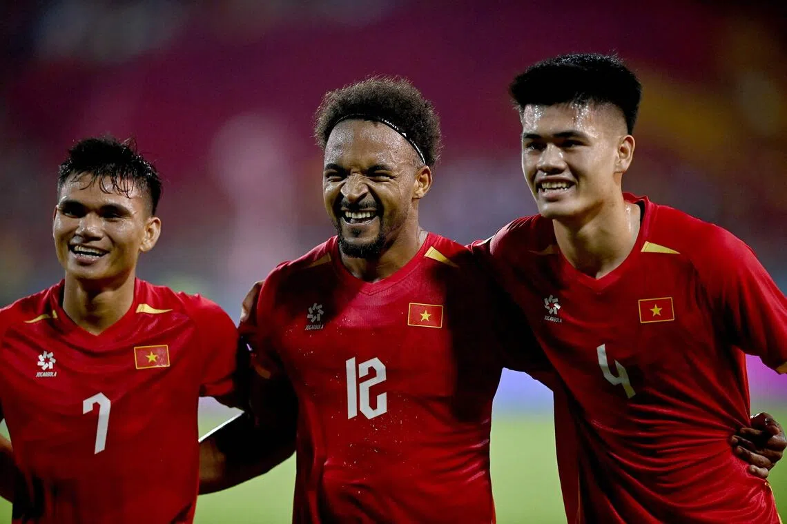 Vietnam’s Nguyen Xuan Son (centre) celebrating with teammates on Aug 19.