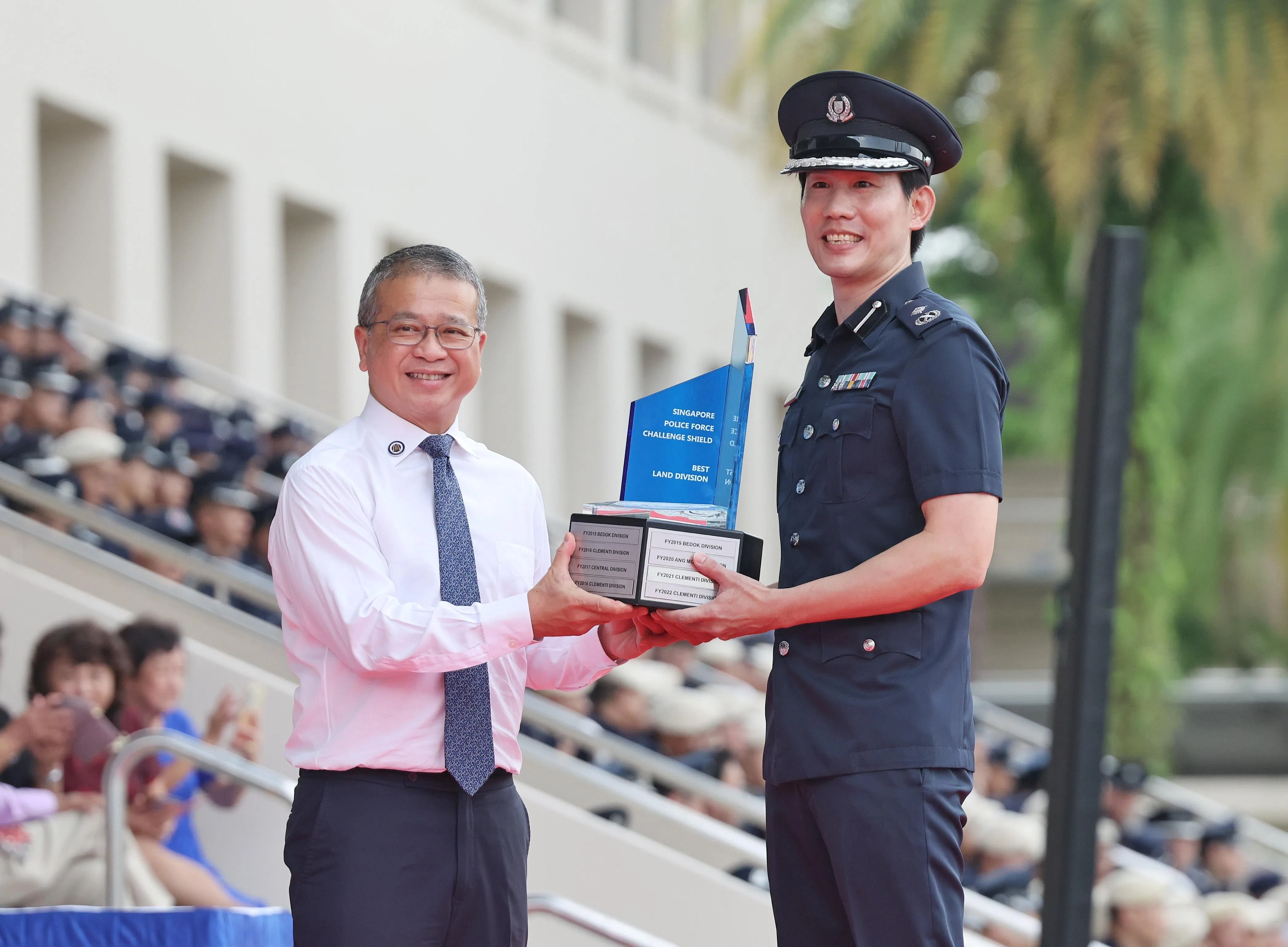 Law Minister Edwin Tong presenting the Best Land Division award to Assistant Commissioner of Police Paul Tay.