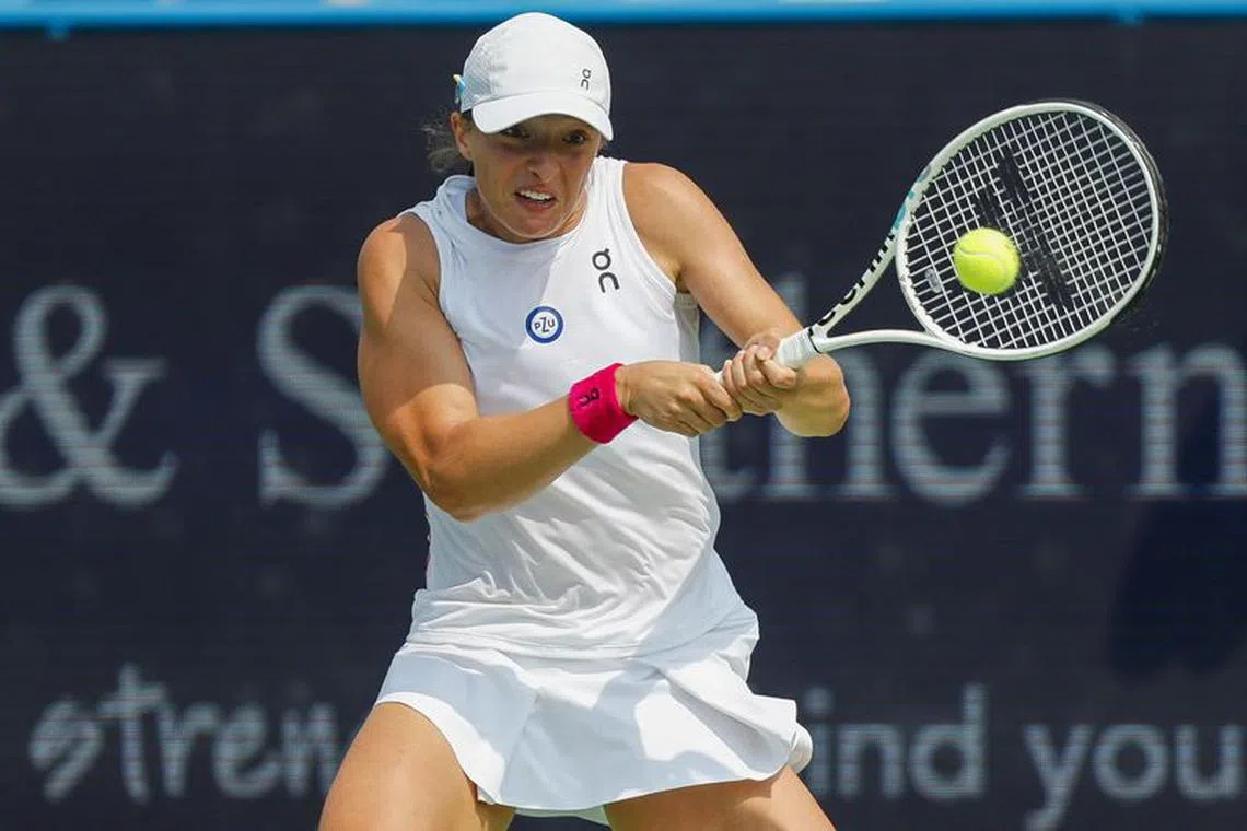 Aug 19, 2023; Mason, OH, USA; Iga Swiatek (POL) returns a shot against Coco Gauff (USA) during the Western and Southern Open tennis tournament at Lindner Family Tennis Center. Mandatory Credit: Katie Stratman-USA TODAY Sports