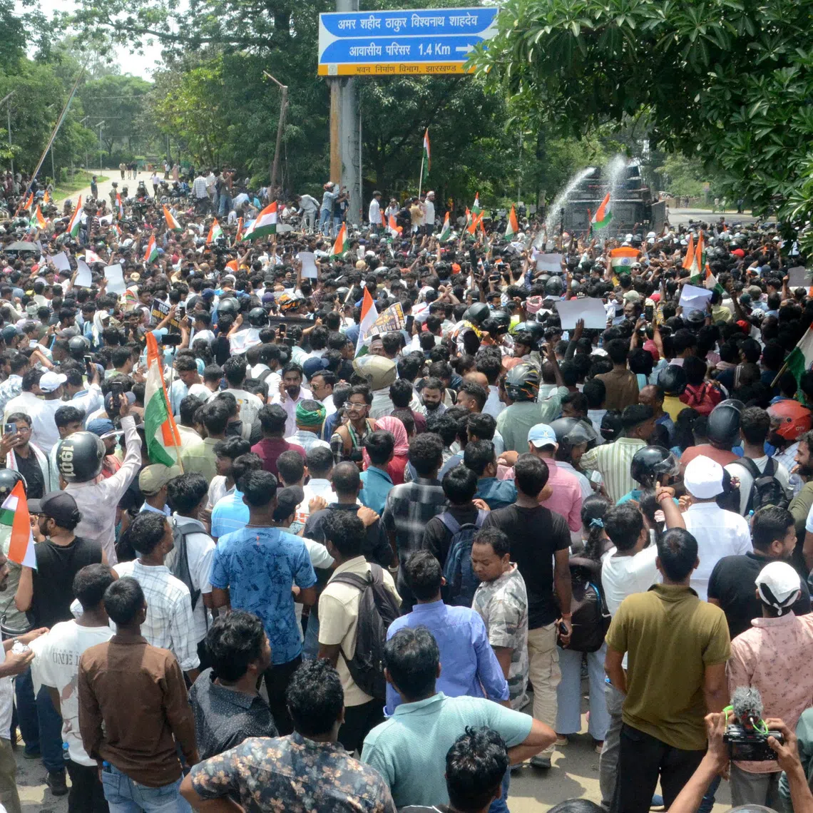 Demonstrators march on the state legislature as police use water cannons to disperse them during a protest against alleged irregularities in the state's civil services examinations, in Ranchi, India, August 10, 2026. REUTERS/Stringer