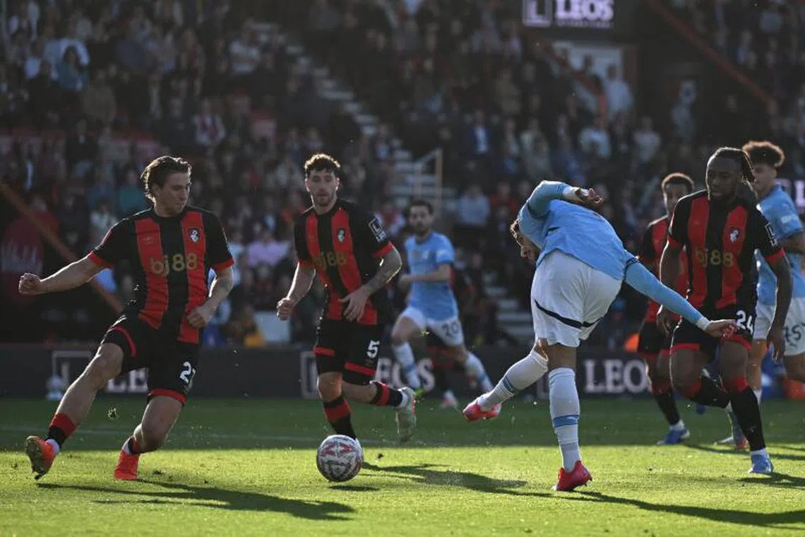 Manchester City's Egyptian striker #07 Omar Marmoush shoots to score their second goal.