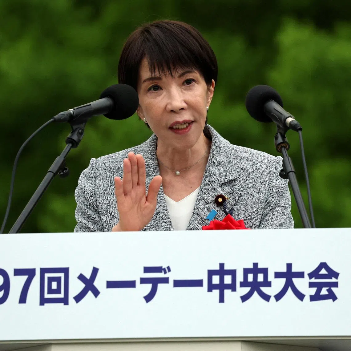 Japan's Prime Minister Sanae Takaichi delivers a speech during an annual May Day rally, where workers advocate for their rights, at Yoyogi Park in Tokyo on April 29.  