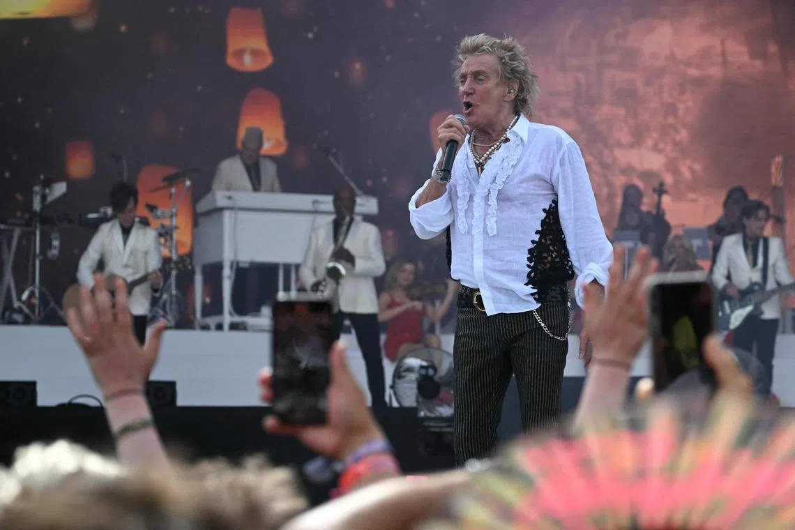 TOPSHOT - British rock legend Rod Stewart performs on the Pyramid Stage on the final day of the Glastonbury festival at Worthy Farm in the village of Pilton in Somerset, south-west England, on June 29, 2025. (Photo by Oli SCARFF / AFP)