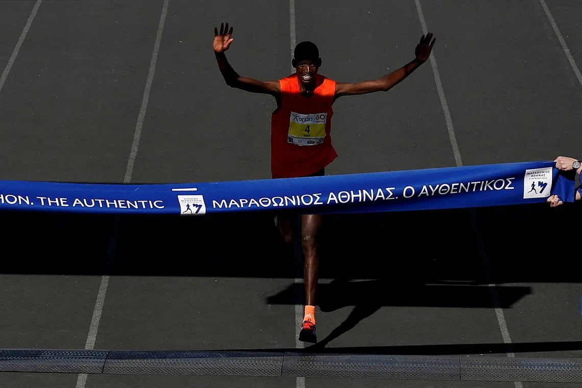 FILE PHOTO: Brimin Kipkorir Misoi from Kenya reacts while finishing first in the Athens Marathon race, Athens, Greece November 11, 2018. REUTERS/Costas Baltas/File Photo