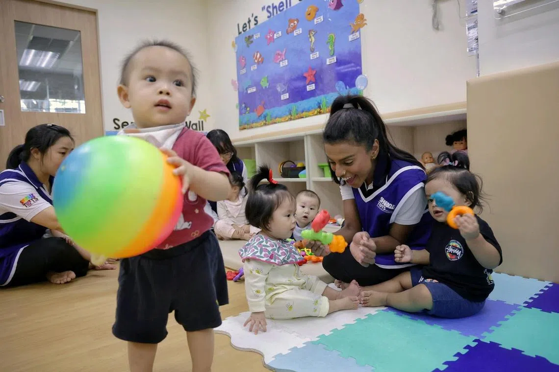 Infant educator Christine St Knight (right), 30, engaging infants in playtime at PCF Sparkletots @ 337 Canberra on Sept 4, 2024.