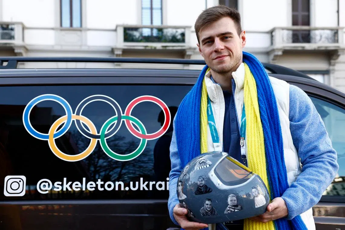 Milano Cortina 2026 Winter Olympics - Skeleton - Vladyslav Heraskevych of Ukraine appears before the Court of Arbitration for Sport - Hilton Milan, Milan, Italy - February 13, 2026 Vladyslav Heraskevych of Ukraine poses for a picture with his helmet after appearing before Court of Arbitration for Sport following his disqualification from the Milano Cortina 2026 Winter Olympics for wearing a helmet in tribute to athletes who have died amid Russia's attack on Ukraine REUTERS/Alessandro Garofalo