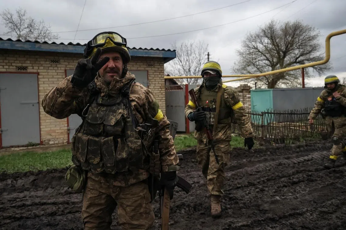 Ukrainian servicemen in a village near the front line, in Ukraine's Donetsk region.