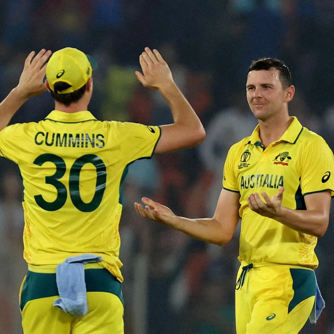 FILE PHOTO: Cricket - ICC Cricket World Cup 2023 - England v Australia - Narendra Modi Stadium, Ahmedabad, India - November 4, 2023 Australia's Josh Hazlewood celebrates with Pat Cummins after taking the wicket of England's Adil Rashid, caught by Josh Inglis to win the match REUTERS/Amit Dave/File Photo