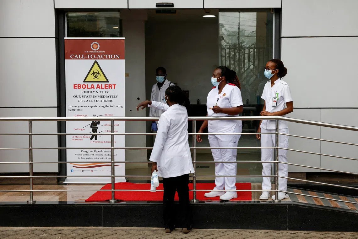 Staff members work at Nairobi Hospital where an Ebola patient was isolated immediately upon arrival and treated at the hospital's physically separate East Wing Isolation Facility, but later died, in Nairobi, Kenya October 7, 2026. REUTERS/Monicah Mwangi