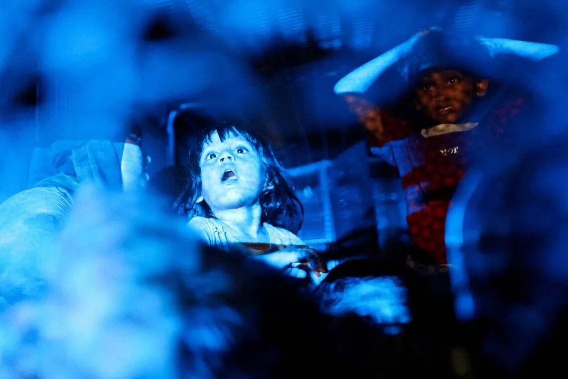 Rohingya refugees sit inside a truck as they are taken by police in front of the office of the U.N. Refugee Agency after being evicted from their homes, at Kuala Lumpur Malaysia July 27, 2026. REUTERS/Hasnoor Hussain TPX IMAGES OF THE DAY