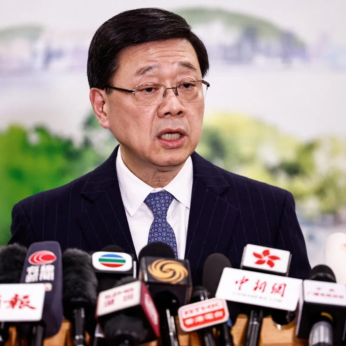 Chief Executive of Hong Kong John Lee speaks during a press conference in Beijing, China December 16, 2025. REUTERS/Tingshu Wang