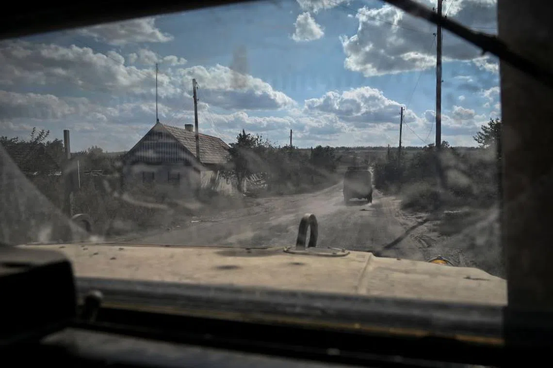 FILE PHOTO: A military vehicle carrying servicemen of Ukraine’s 3rd Separate Assault Brigade drives down a road during a reconnaissance mission, amid Russia's attack on Ukraine, near Bakhmut, Ukraine September 7, 2023. REUTERS/Stringer/File photo