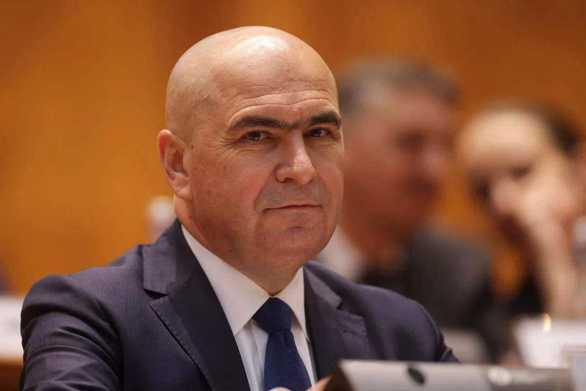 FILE PHOTO: Romania's designated Prime Minister Ilie Bolojan looks on, at the start of a joint parliamentary session, ahead of a vote of confidence in his coalition, in Bucharest, Romania, June 23, 2025. Inquam Photos/George Calin via REUTERS/File Photo