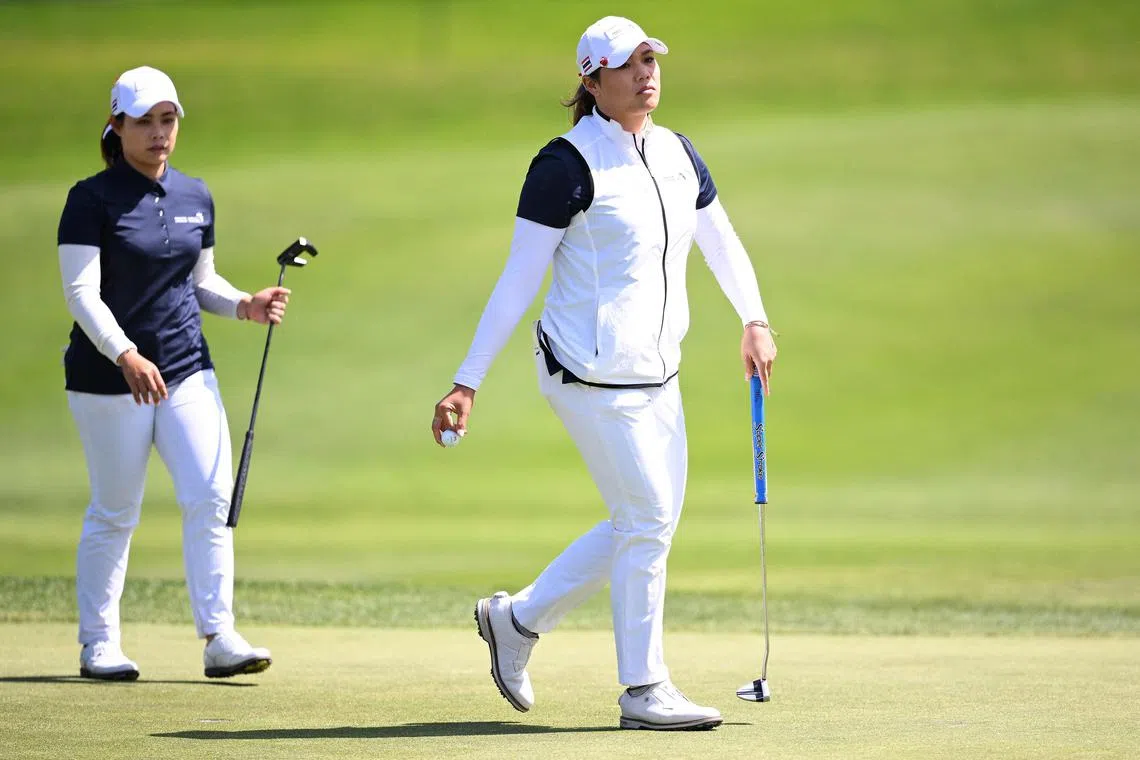 Moriya Jutanugarn (left) and her sister Ariya of Team Thailand look on from the fifth green during their semi-final against the US in the International Crown event on Sunday. 
