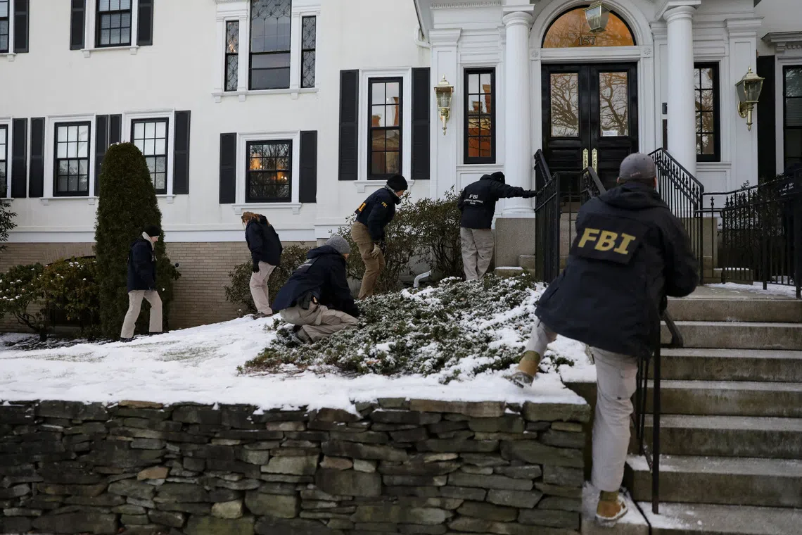 Law enforcement officers canvass Waterman Street as the manhunt continues for the gunman, following a shooting at Brown University in Providence, Rhode Island, U.S. December 15, 2025.  REUTERS/Taylor Coester