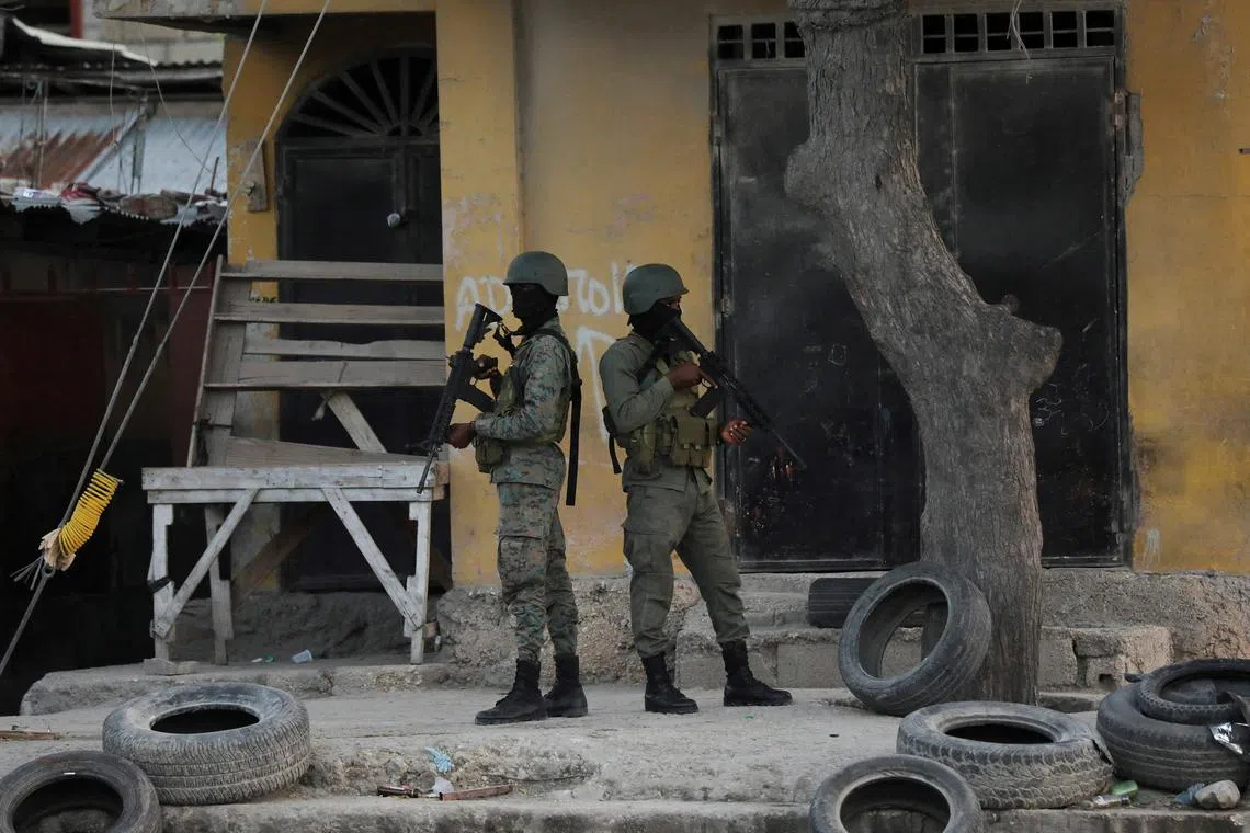 FILE PHOTO: Haitian soldiers patrol near the Toussaint Louverture International Airport following a gunfight with armed gangs on the surroundings of the airport, as the government declared state of emergency amid violence, in Port-au-Prince, Haiti, March 4, 2024. REUTERS/Ralph Tedy Erol/File Photo