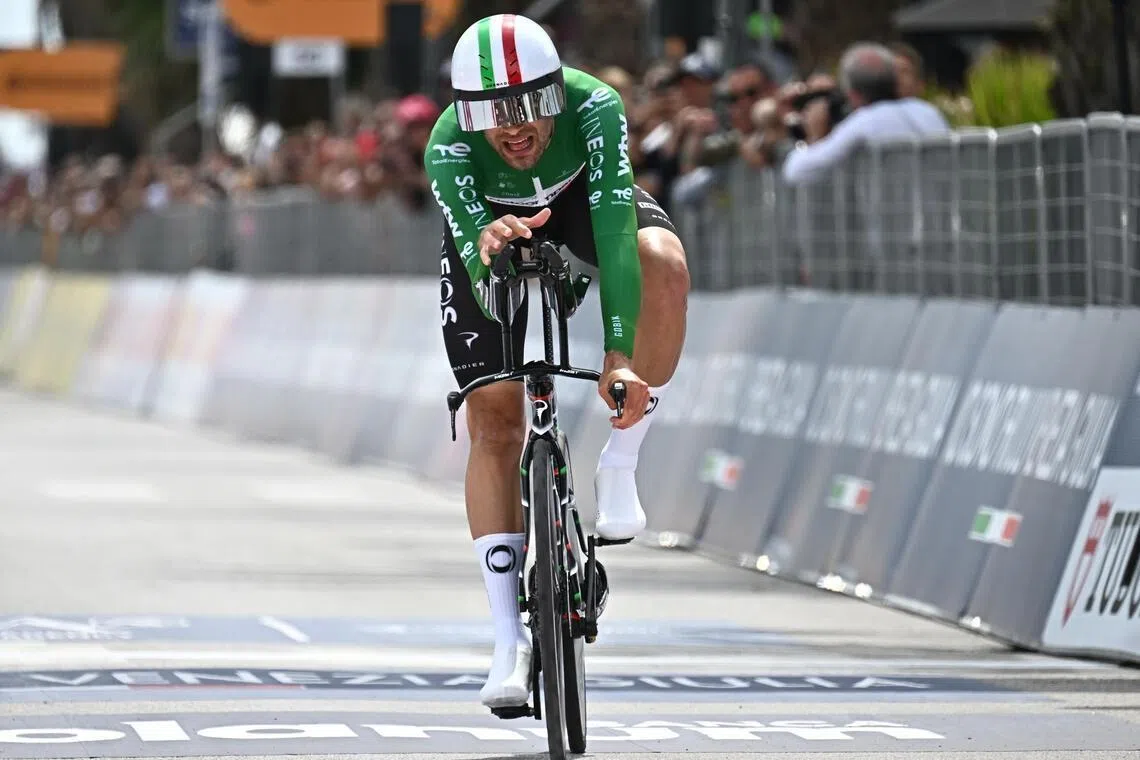 Italian cyclist Filippo Ganna of team Netcompany INEOS crosses the finish line of the 10th stage of the Giro d'Italia, an individual time trial (ITT) over 42 km from Viareggio to Massa, on May 19, 2026.