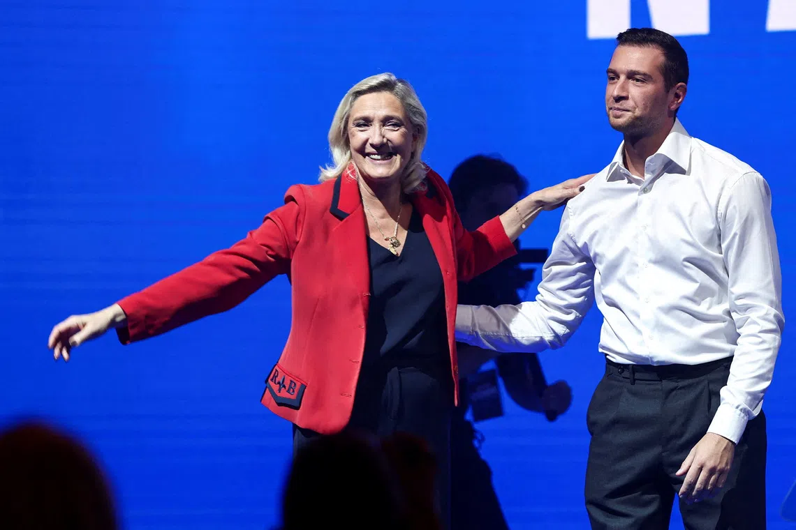 FILE PHOTO: FILE PHOTO: Marine Le Pen, French member of parliament and parliamentary leader of the far-right National Rally (Rassemblement National - RN) party and Jordan Bardella, president of the French far-right National Rally (Rassemblement National - RN) party and member of the European Parliament, attend an RN political rally in Bordeaux, France, September 14, 2025. REUTERS/Stephane Mahe/File Photo