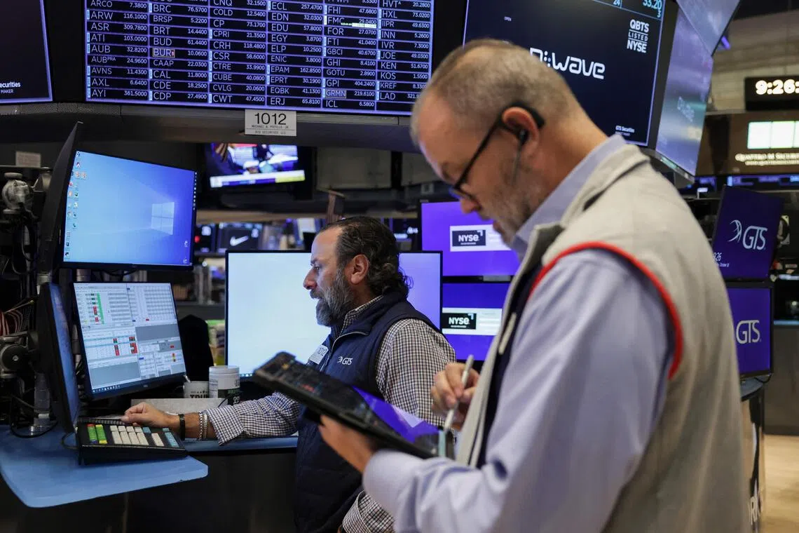 Traders working on the floor of the New York Stock Exchange, in New York City, on Oct 30.