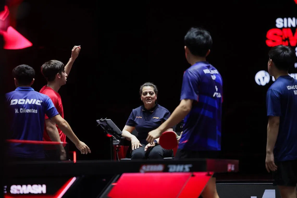 Singapore's Koen Pang and Izaac Quek (right) speak with the umpire after their Argentine rivals were penalised a point during their match. 