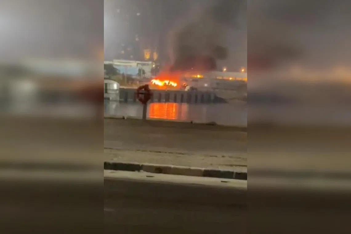 A fire burning at the port of Kish Island in Iran, in a screengrab taken from a social media video released on July 14.