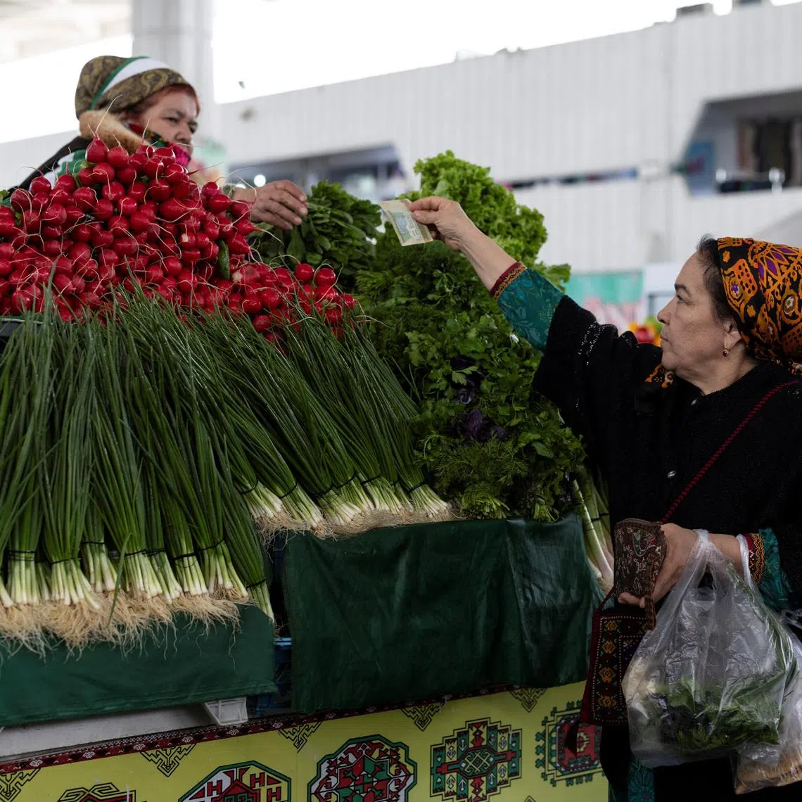 A woman buys vegetables at an open market in Ashgabat, Turkmenistan, in March Vegetable oil prices are particularly elevated amid the Iran war and the effective closure of the Strait of Hormuz.