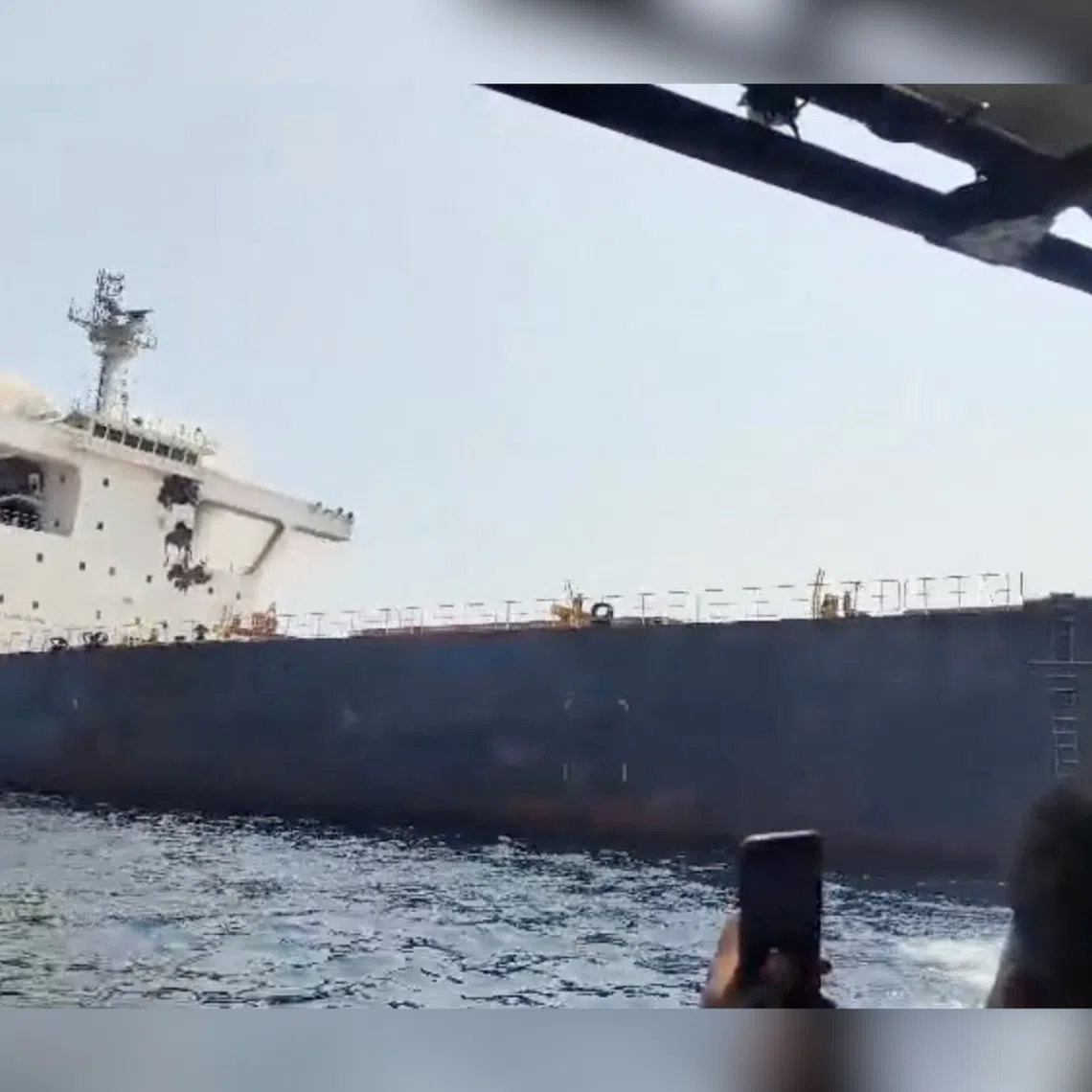 Smoke rises from the bulk carrier vessel Cape Dao that came under attack while sailing from the UAE toward India.