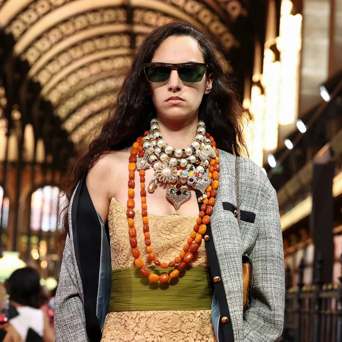A model presents a creation by designer Alessandro Michele as part of his Spring/Summer 2027 collection show for fashion house Valentino during Paris Fashion Week in Paris, France, on Oct 4.