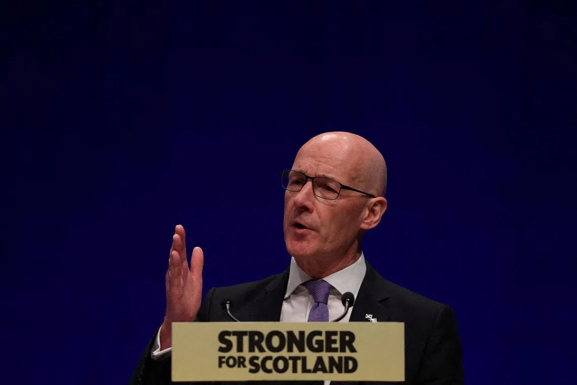 FILE PHOTO: John Swinney speaks at the SNP Annual National Conference in Aberdeen, Scotland, Britain October 9, 2022. REUTERS/Russell Cheyne/File Photo